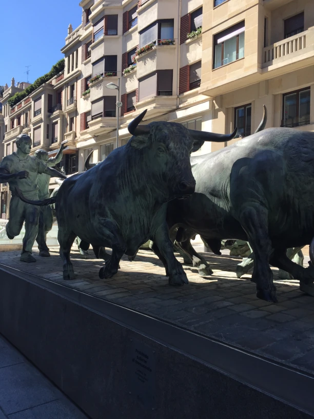 This is an image of
               a statue of bulls running.